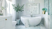 A bright white bathroom featuring a spacious tub beneath an elegant chandelier, creating a luxurious atmosphere.