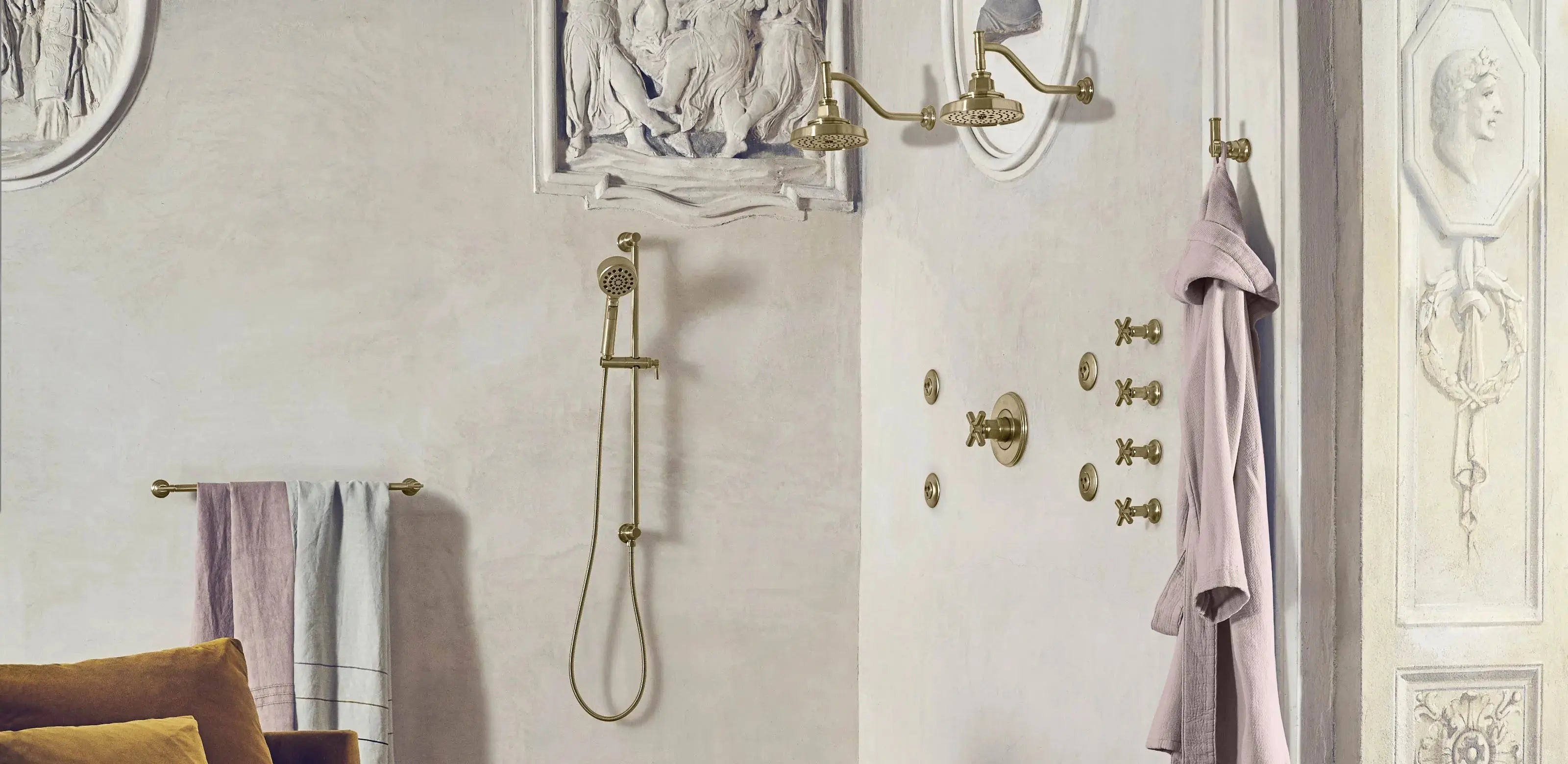 A bathroom featuring a shower, a toilet, and a chair, designed for comfort and functionality