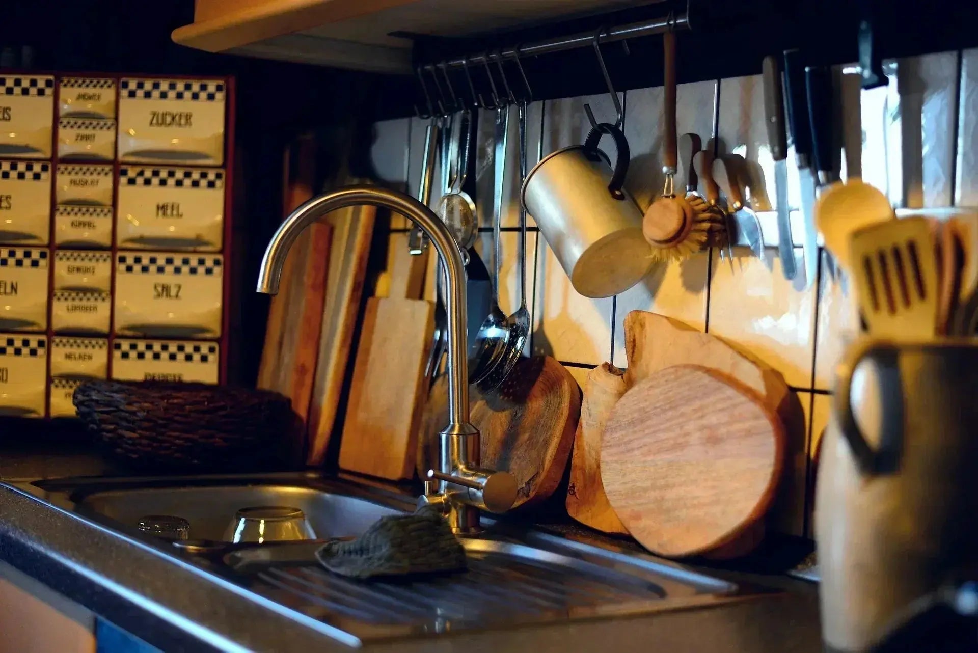 A kitchen sink featuring a modern kitchen faucet, showcasing a clean and functional design.