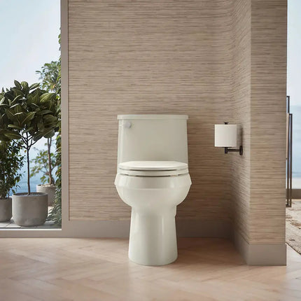 Kohler Adair Comfort Height One-piece elongated toilet, 1.28 gpf Biscuit - Plumbing Market